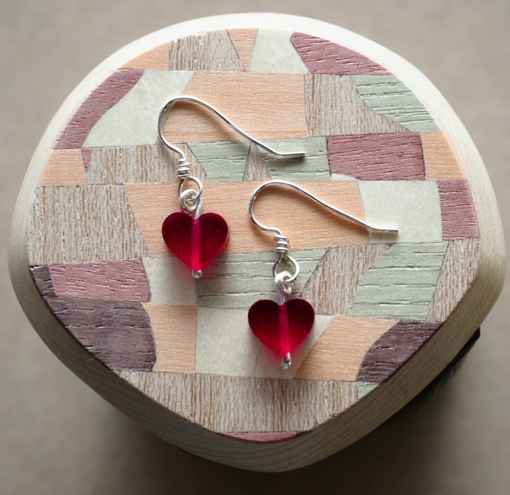 Garnet colored heart shaped handmade sweetheart earrings.